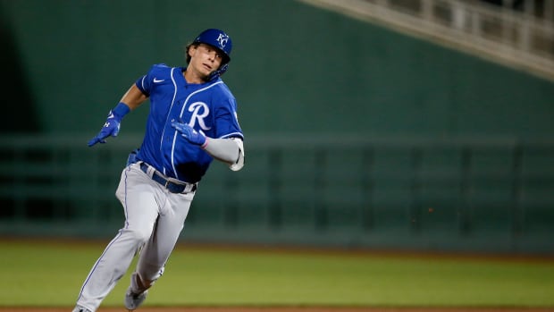 Kansas City Royals Bobby Witt Jr., rounds the bases on an error, inside the park home run, which was misplayed by Cincinnati Reds left fielder Errol Robinson in the eighth inning of the MLB Cactus League Spring Training game between the Cincinnati Reds and the Kansas City Royals at Goodyear Ballpark in Goodyear, Ariz., on Thursday, March 4, 2021. The Royals won 5-3 in a nine-inning game. Kansas City Royals At Cincinnati Reds Spring Training